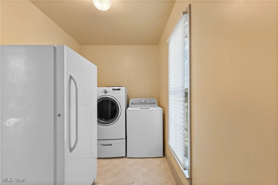Washroom with washing machine and dryer