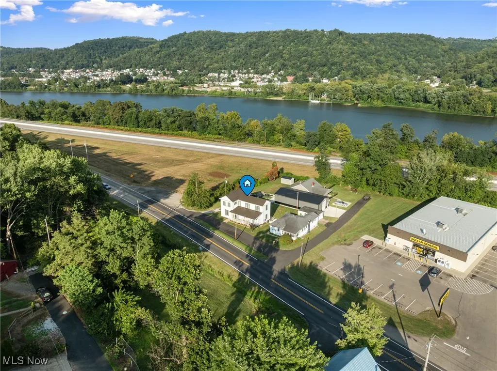 Aerial view of a heavily wooded area and a large body of water