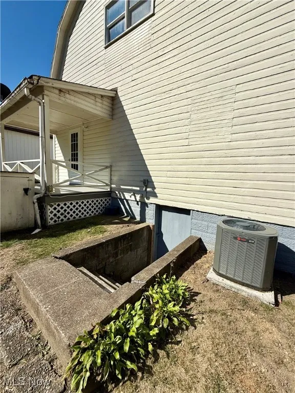 Exterior view of backyard and the central air condition unit