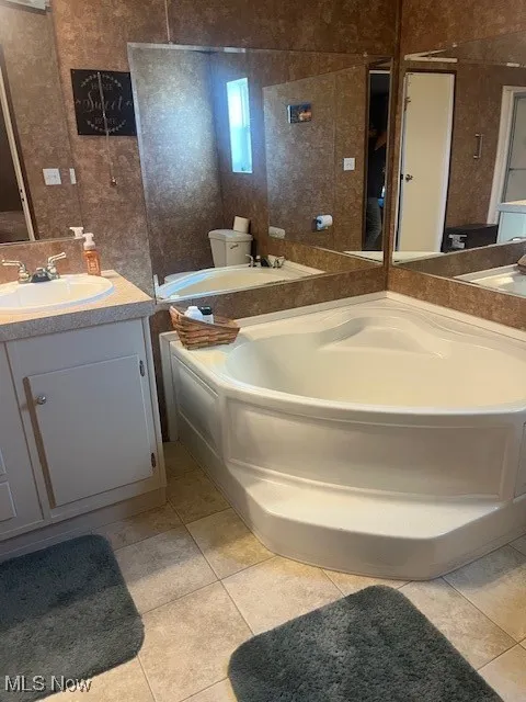 Bathroom featuring vanity and light tile patterned floors