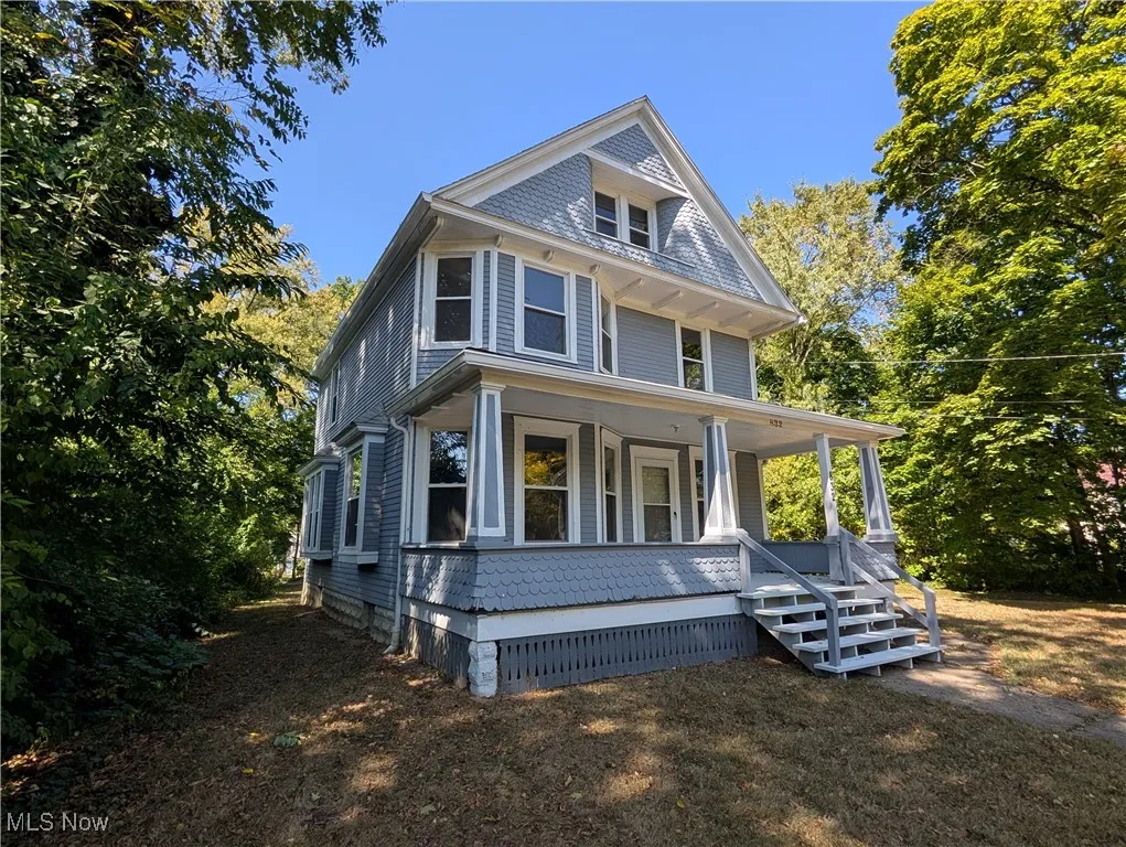 Traditional style home featuring a porch