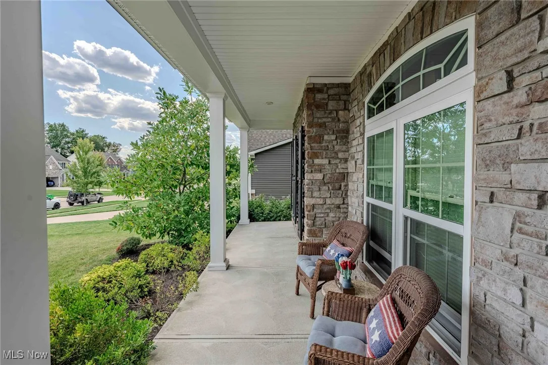 Covered porch with a yard