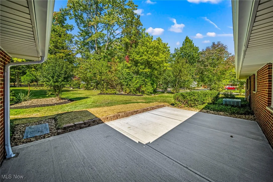 New Concrete Patio Overlooks Deep Backyard