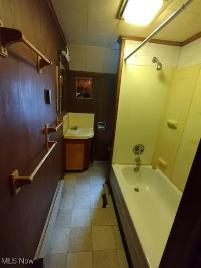 Bathroom with shower / bath combination and vanity