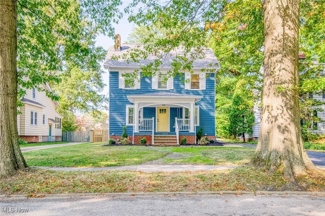 Colonial inspired home with a porch