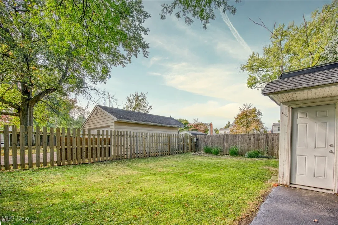 View of fenced backyard
