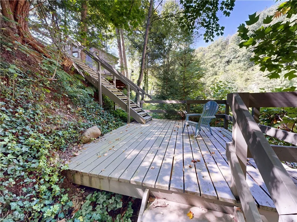 Wooden terrace featuring stairway