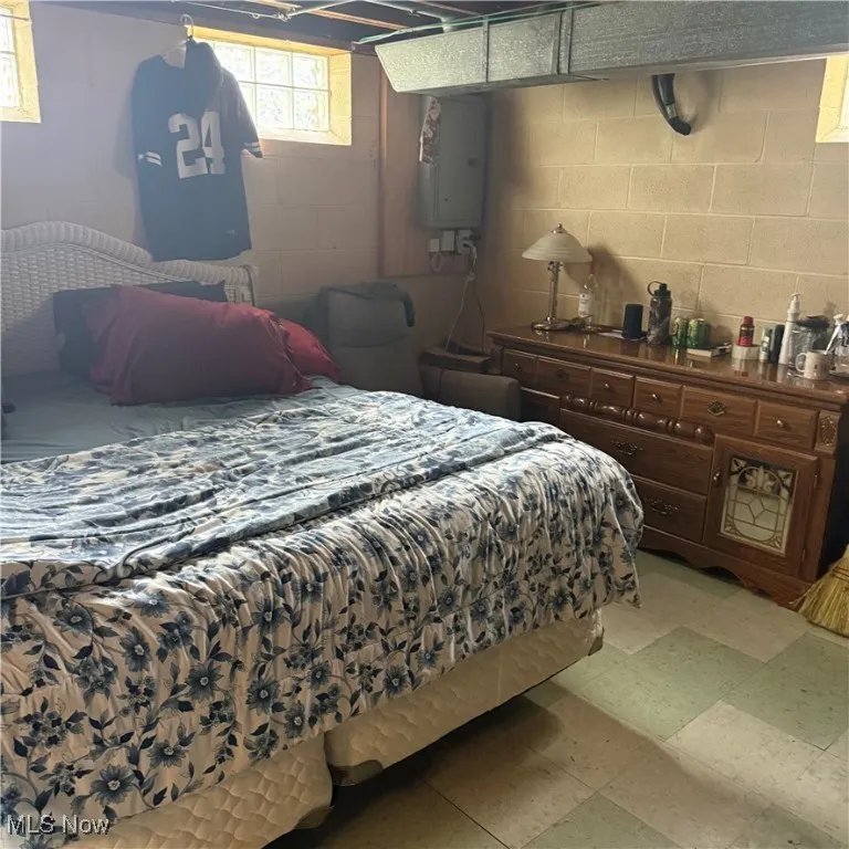 Bedroom featuring electric panel