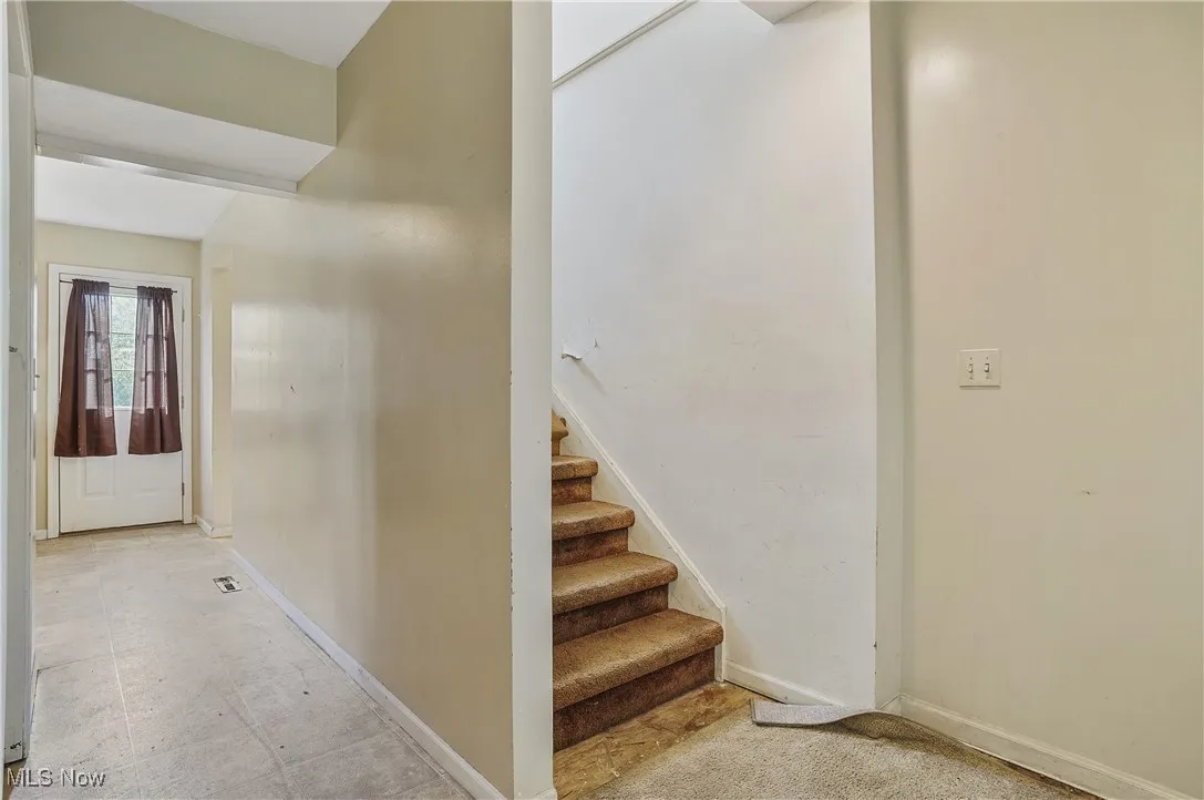 Stairs featuring baseboards