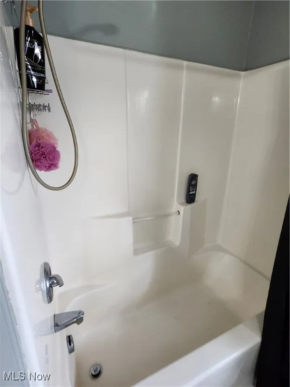 Bathroom featuring shower / bathtub combination