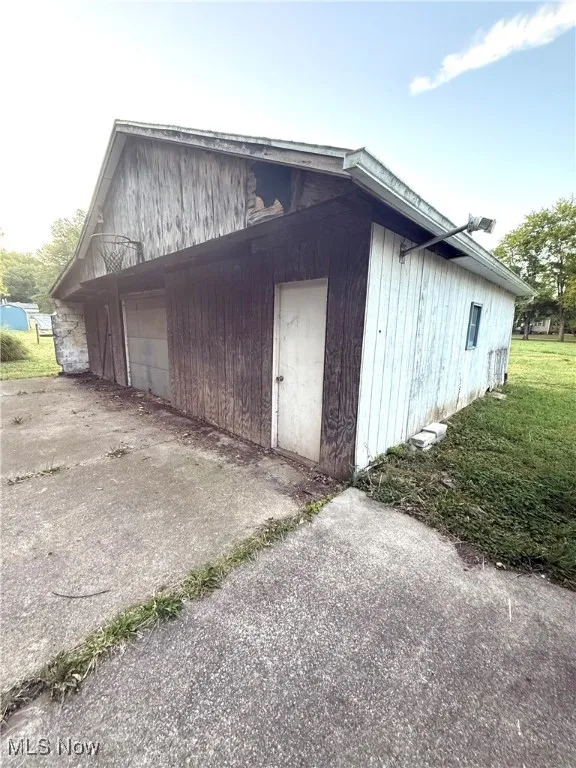 Side view of the garage and hobby barn