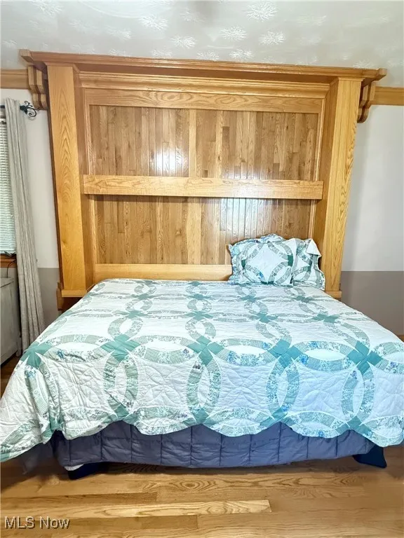 Bedroom with light wood finished floors