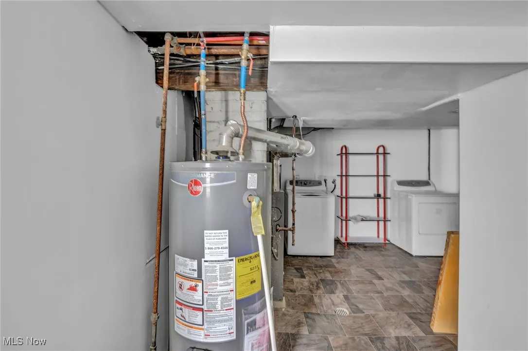 Utilities featuring gas water heater and washer and dryer