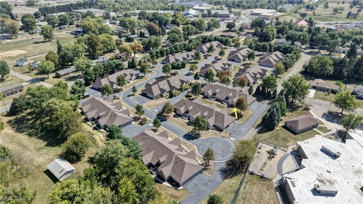 Aerial overview of property's location featuring nearby suburban area