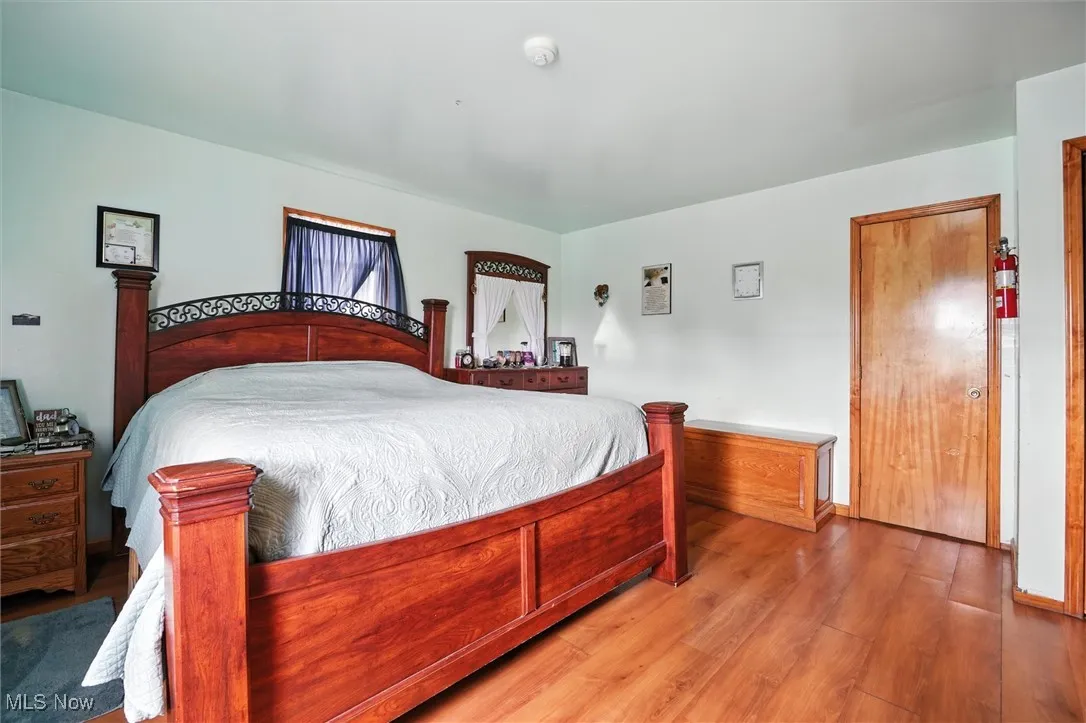 1st floor Bedroom featuring wood finished floors