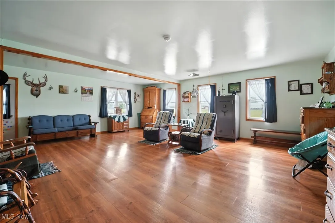 Living room with wood finished floors and baseboards