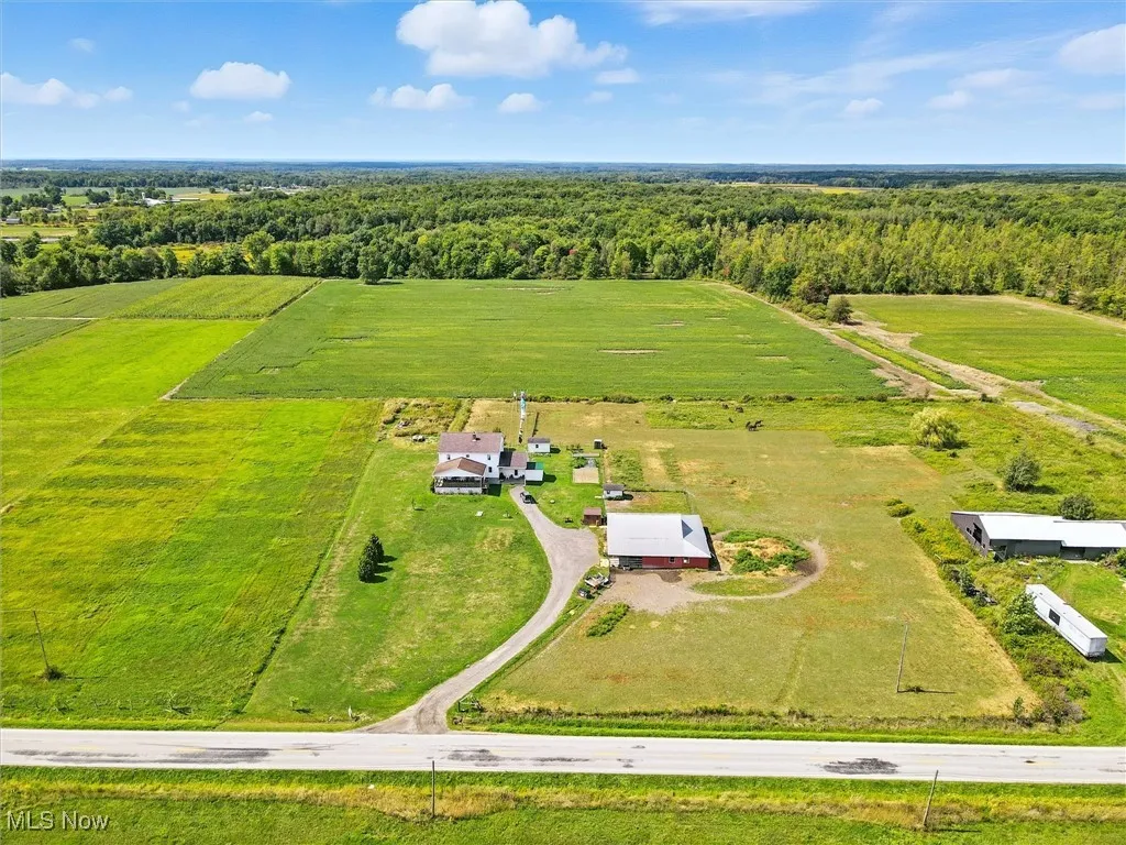 Aerial view of sparsely populated area with a forest