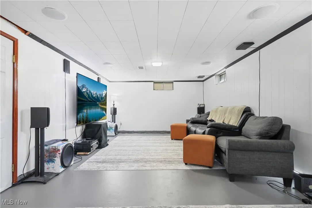 Living room featuring finished concrete floors
