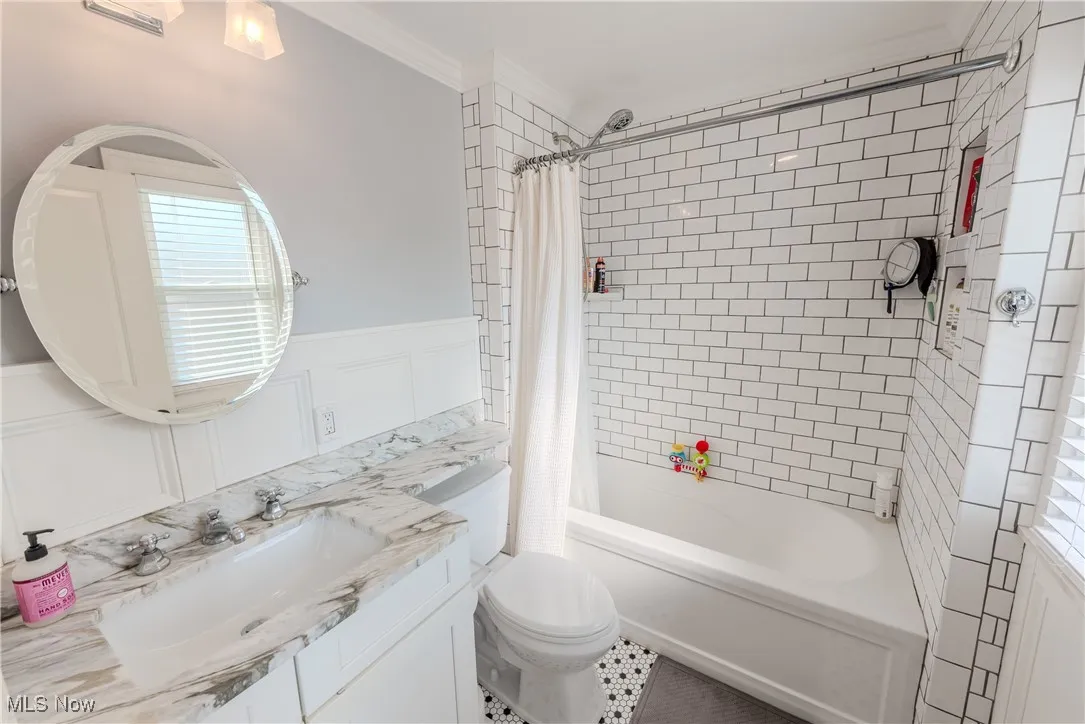 Beautifully updated full bath with shower / tub combo, vanity, a plenty of natural light.