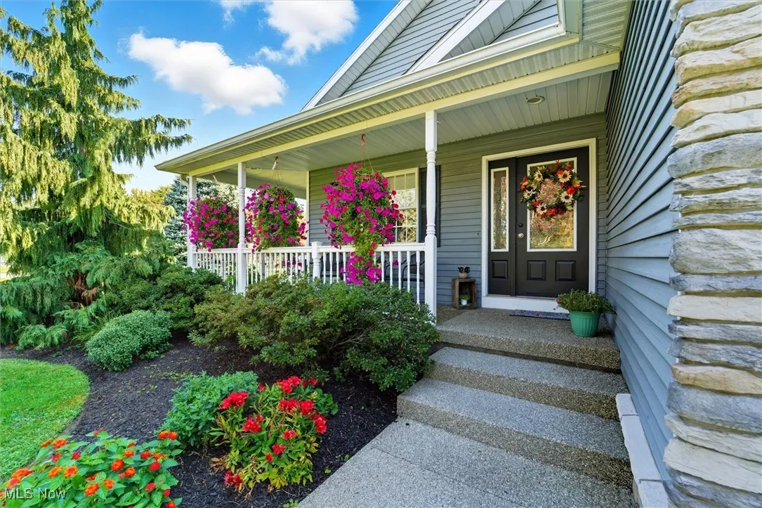 nature stone walkway to front door and wrap-around porch