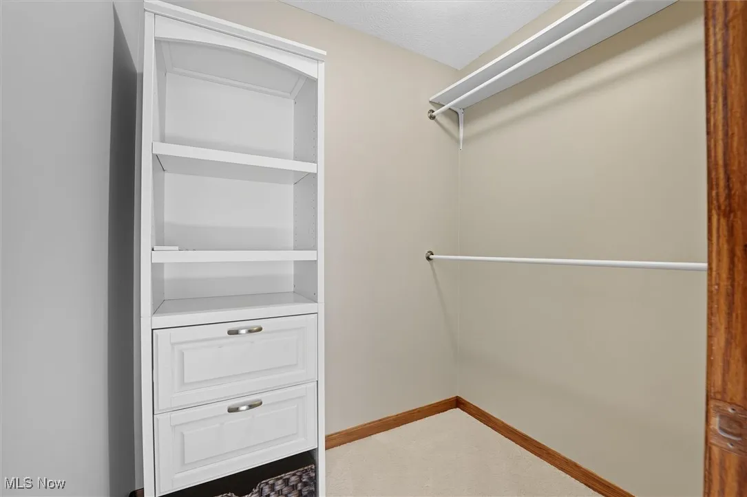 walk in closet in the primary bedroom