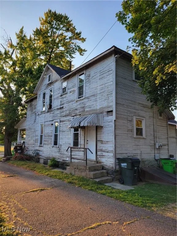 View of front facade with stone siding