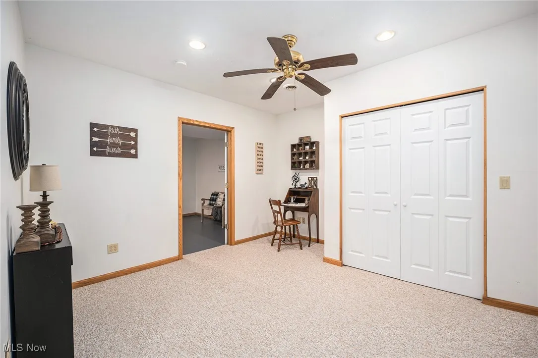 Bedroom with light carpet, recessed lighting, a ceiling fan, and a closet