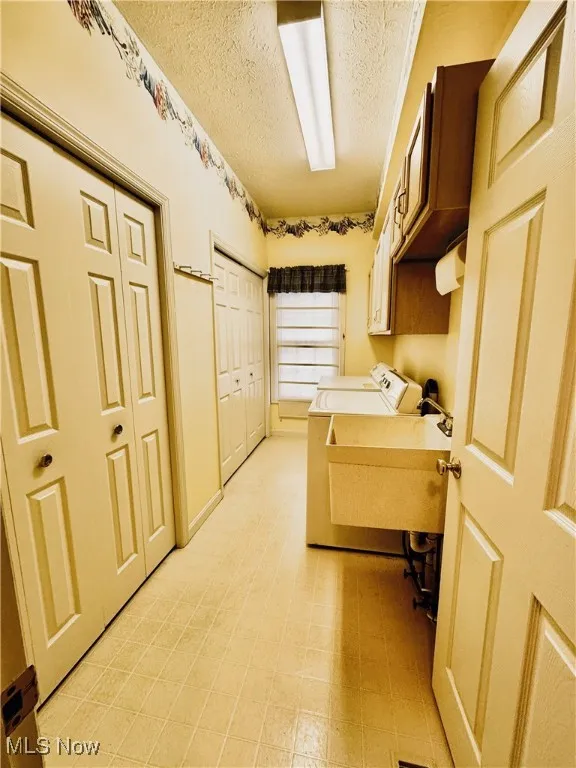 Main floor Laundry with two closets and sink,