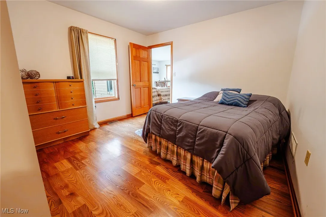 Bedroom with wood finished floors