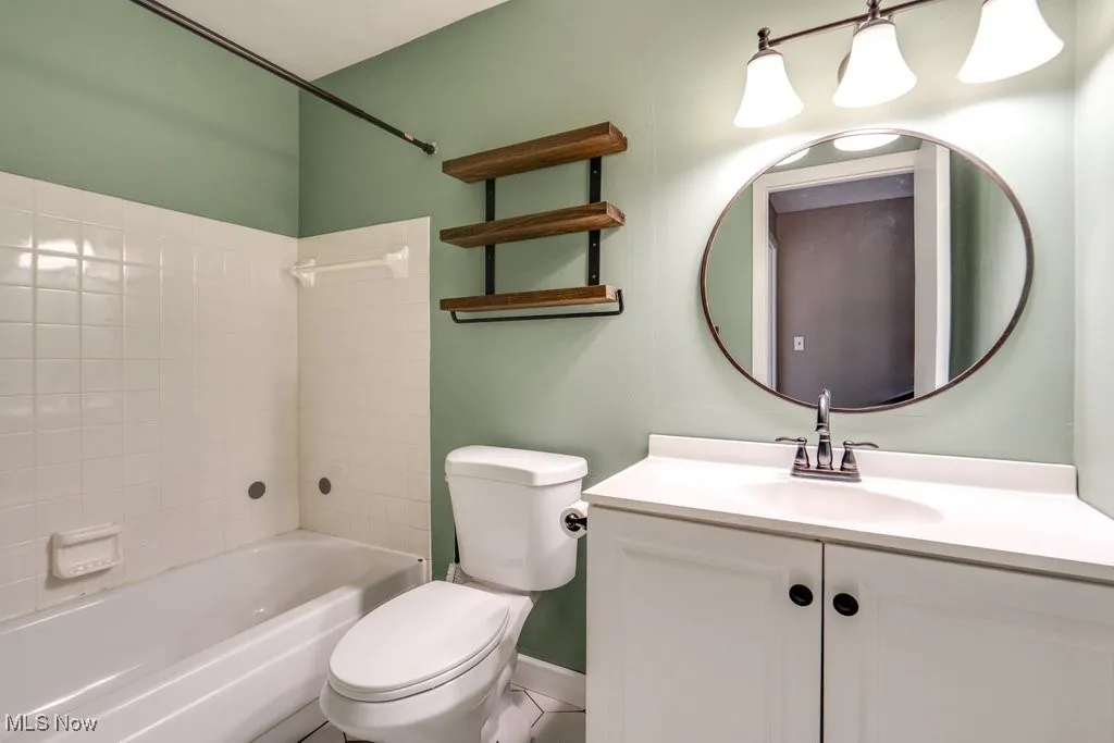 Full bathroom featuring bathing tub / shower combination and vanity