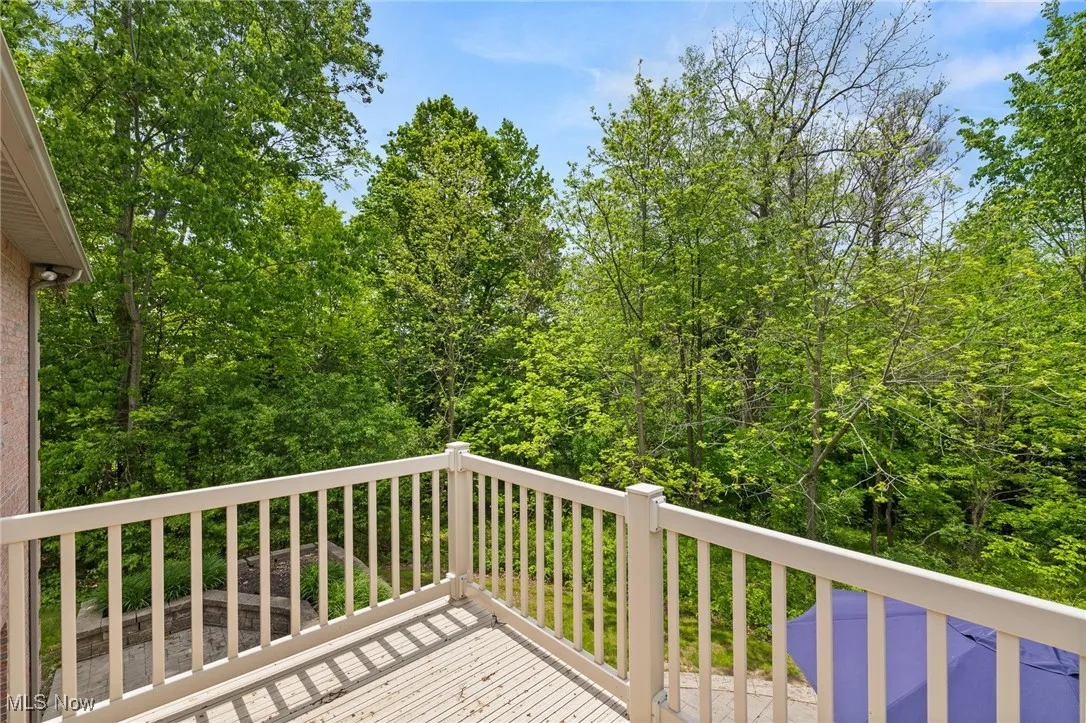 View of wooden deck off of primary suite