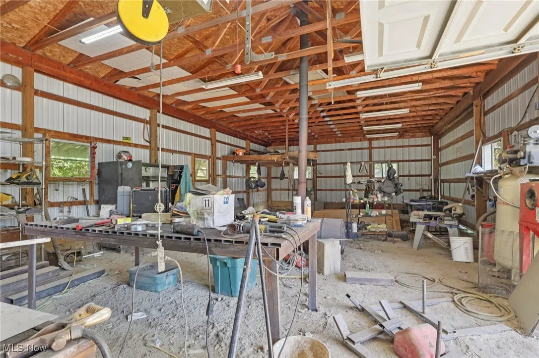 Garage with metal wall and a workshop area