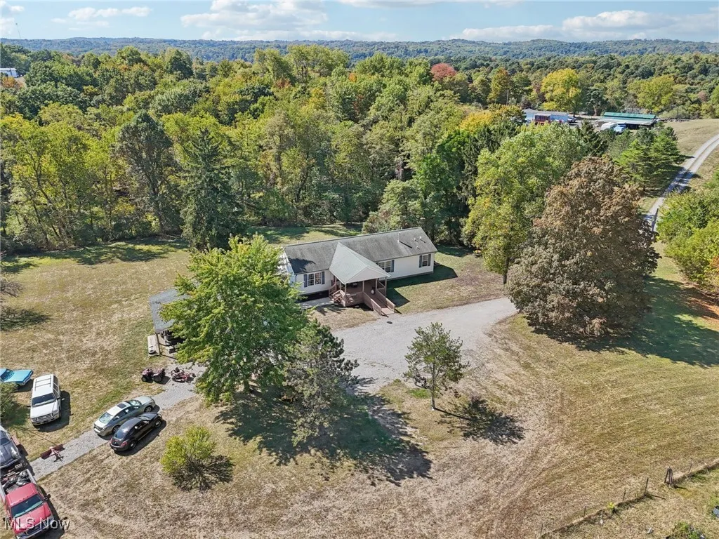 View from above of property with a heavily wooded area