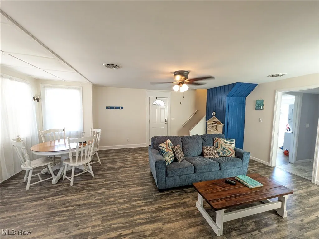 Large Open Living Rm. view showing front entry door and view from kitchen entry