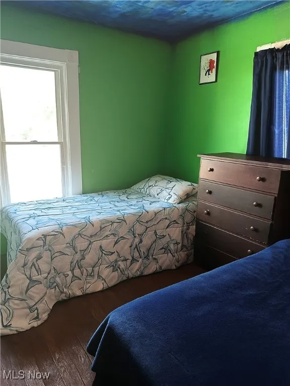 Bedroom with wood finished floors