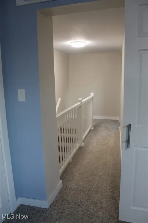 Upstairs hallway leading to stairs