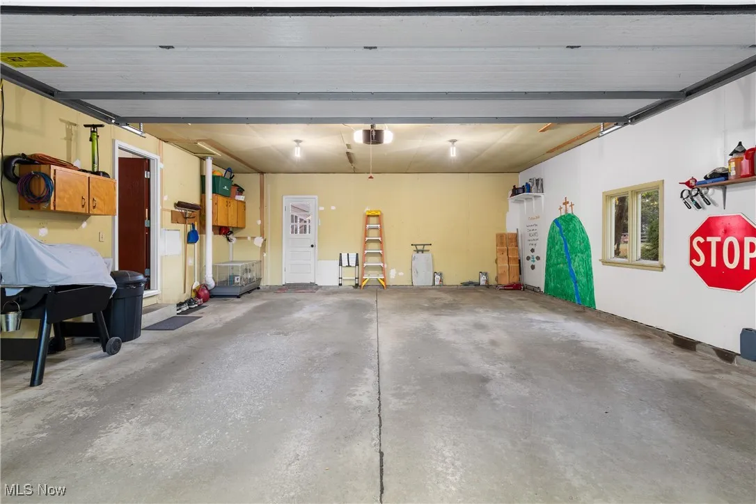 The capacious garage.  The door on the left goes into the kitchen - perfect for carrying groceries in.  The mandoor straight back goes to the large concrete patio.
