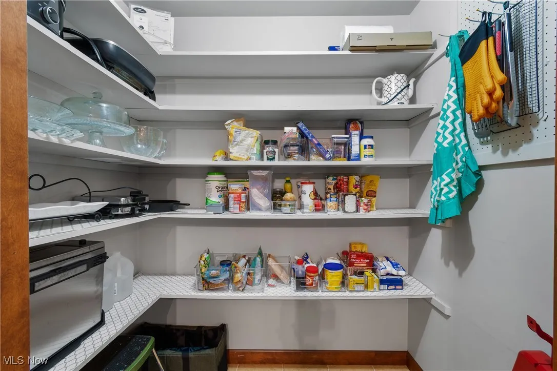 Any cook would welcome this huge, well lit pantry!  You can store food AND larger appliances you don't want to keep in the cabinets.