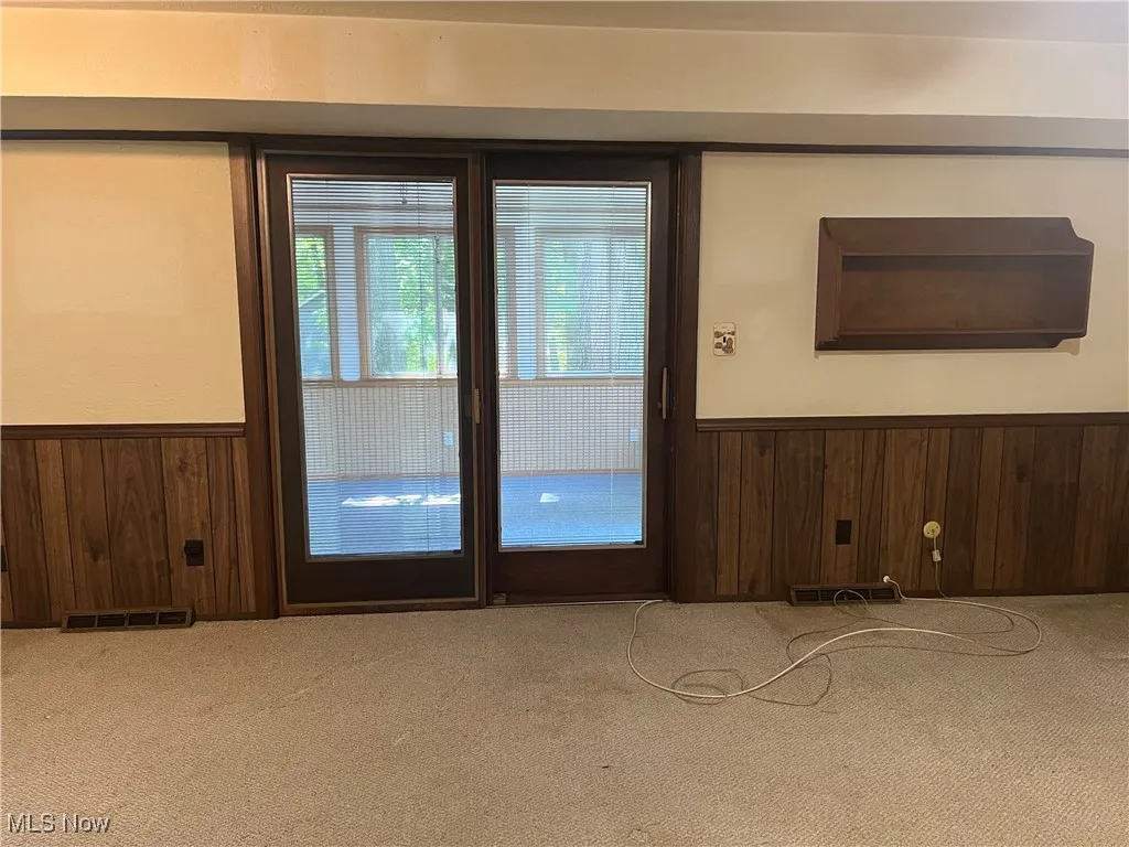 Slider Doors lead to the Sunroom