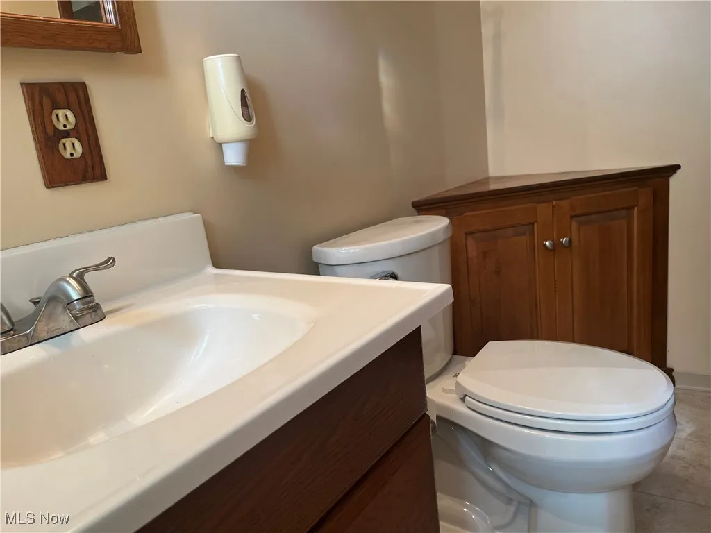 Bathroom with vanity and tile patterned flooring