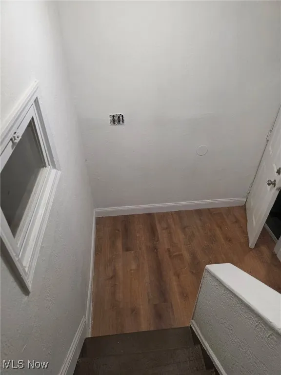 Detailed view of a textured wall and wood finished floors