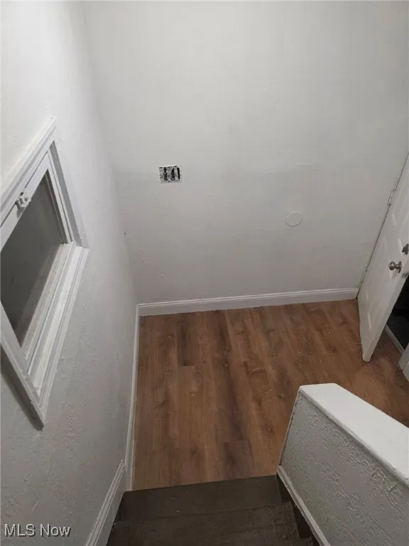 Detailed view of a textured wall and wood finished floors