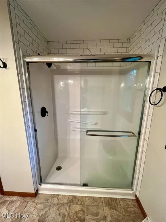 Full bath with a shower stall