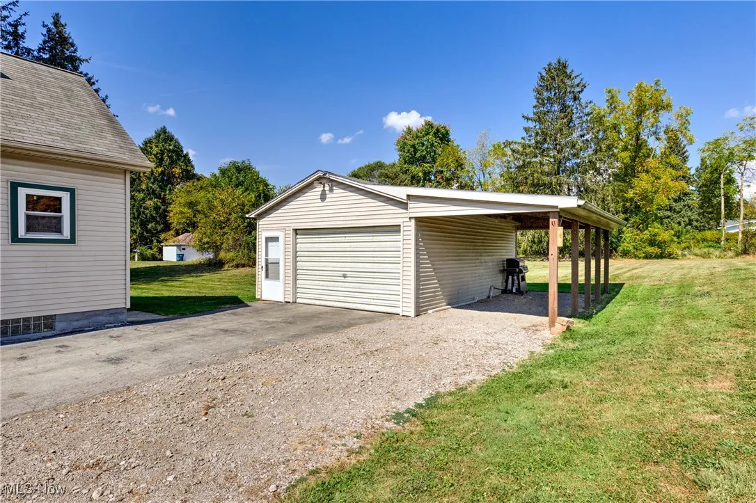 Garage featuring a detached garage