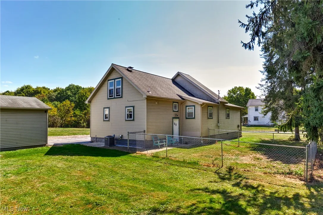 Back of house with a patio
