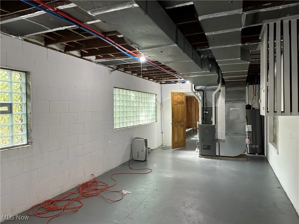 Basement with forced air heating unit and water heater