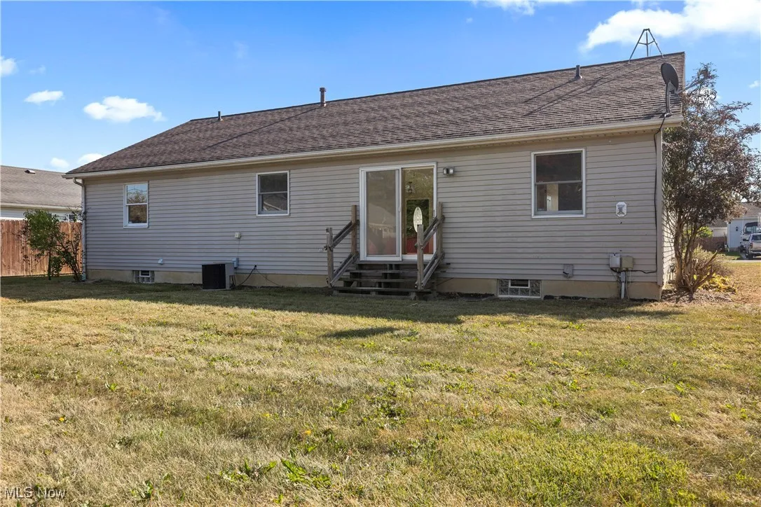 Back of property featuring entry steps