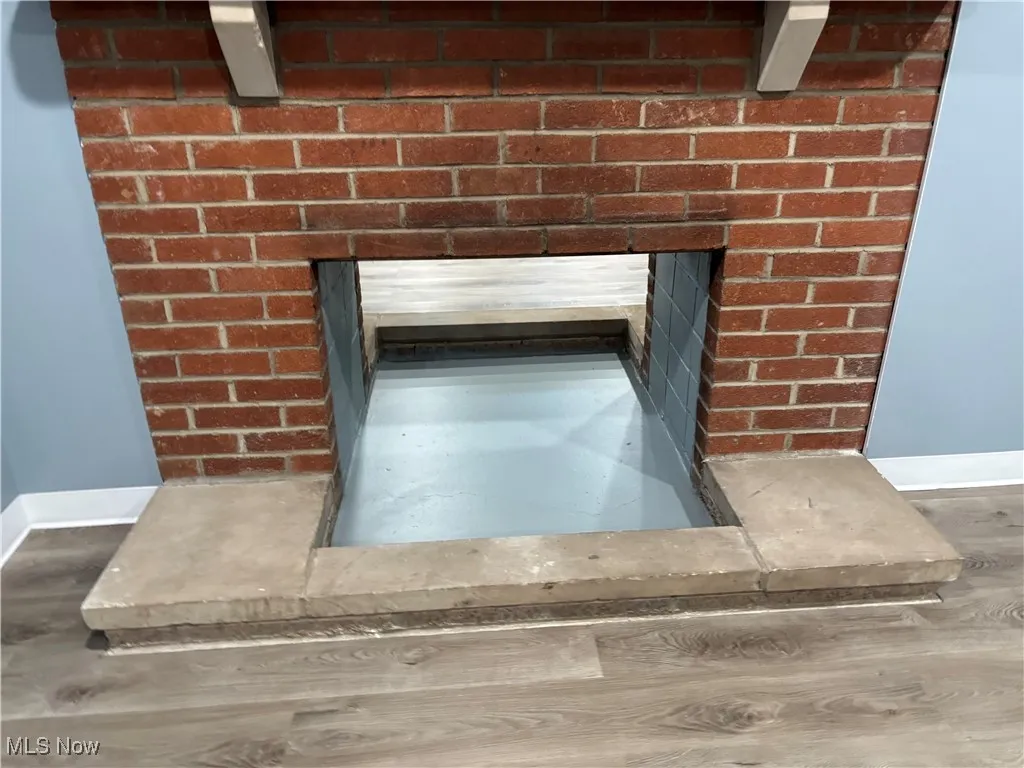 Detailed view of baseboards and wood finished floors