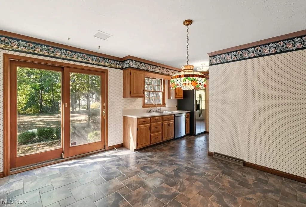 Kitchen with Refaced Cabinets, Microwave Disposal, and Dishwasher