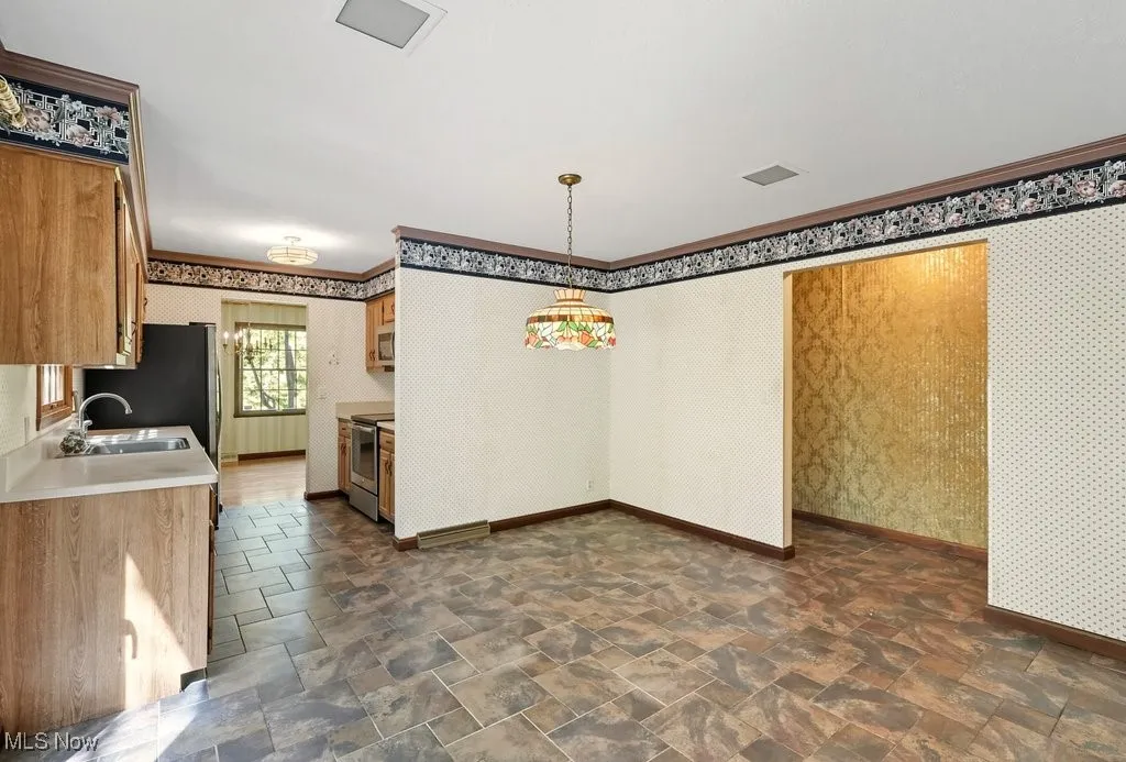 Kitchen with Refaced Cabinets, Microwave Disposal, and Dishwasher